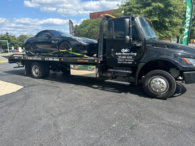 Dalo flatbed truck transporting a vehicle in Northern Virginia
