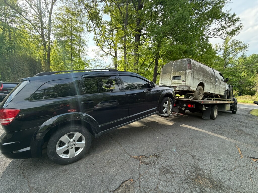 Non-running van being loaded for junk car removal in Virginia